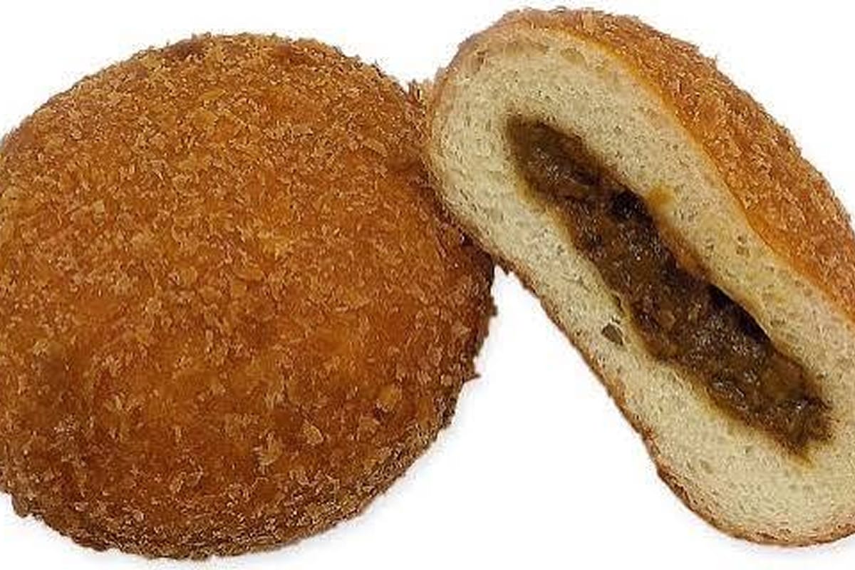 Fried curry bread cut in half to show the curry filling