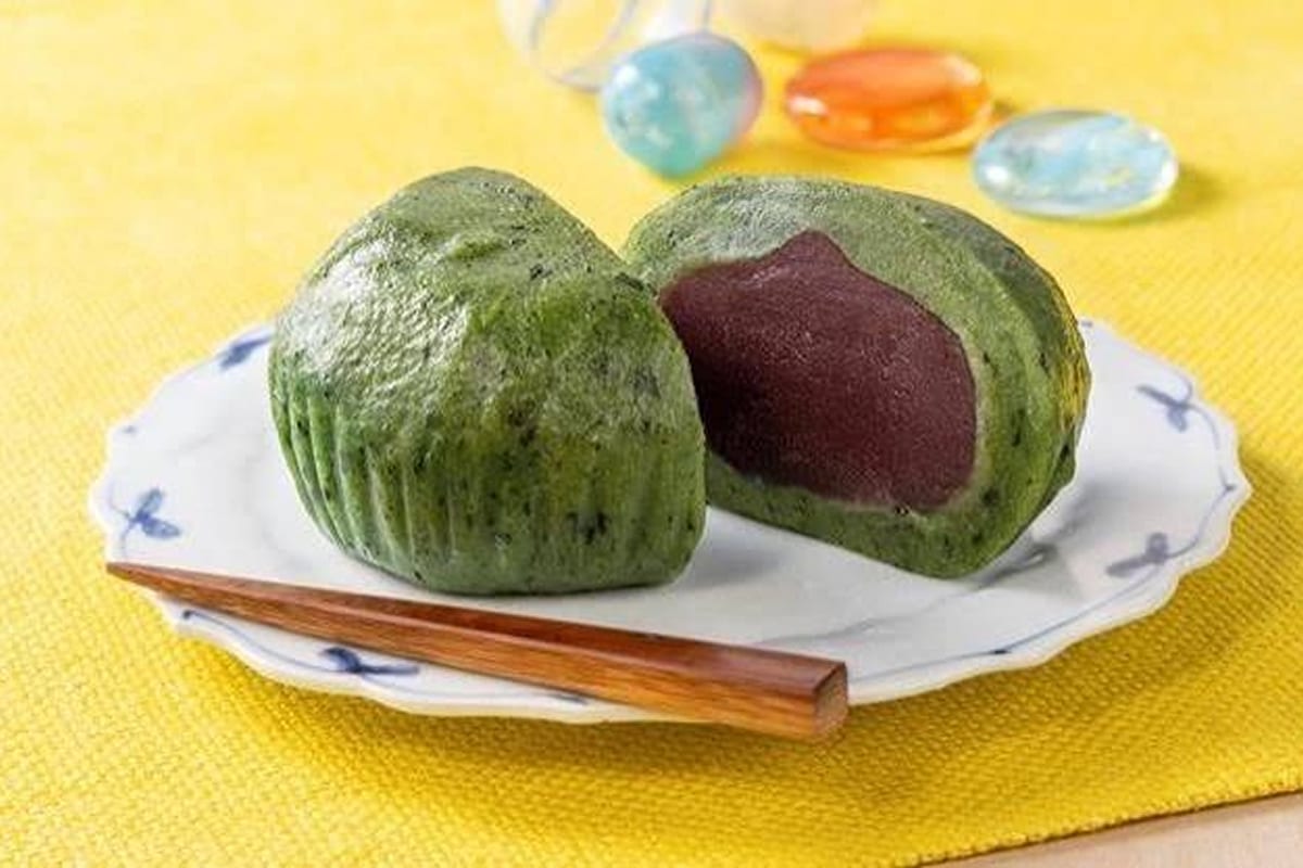 Green and purple mochi sweets served on a small plate