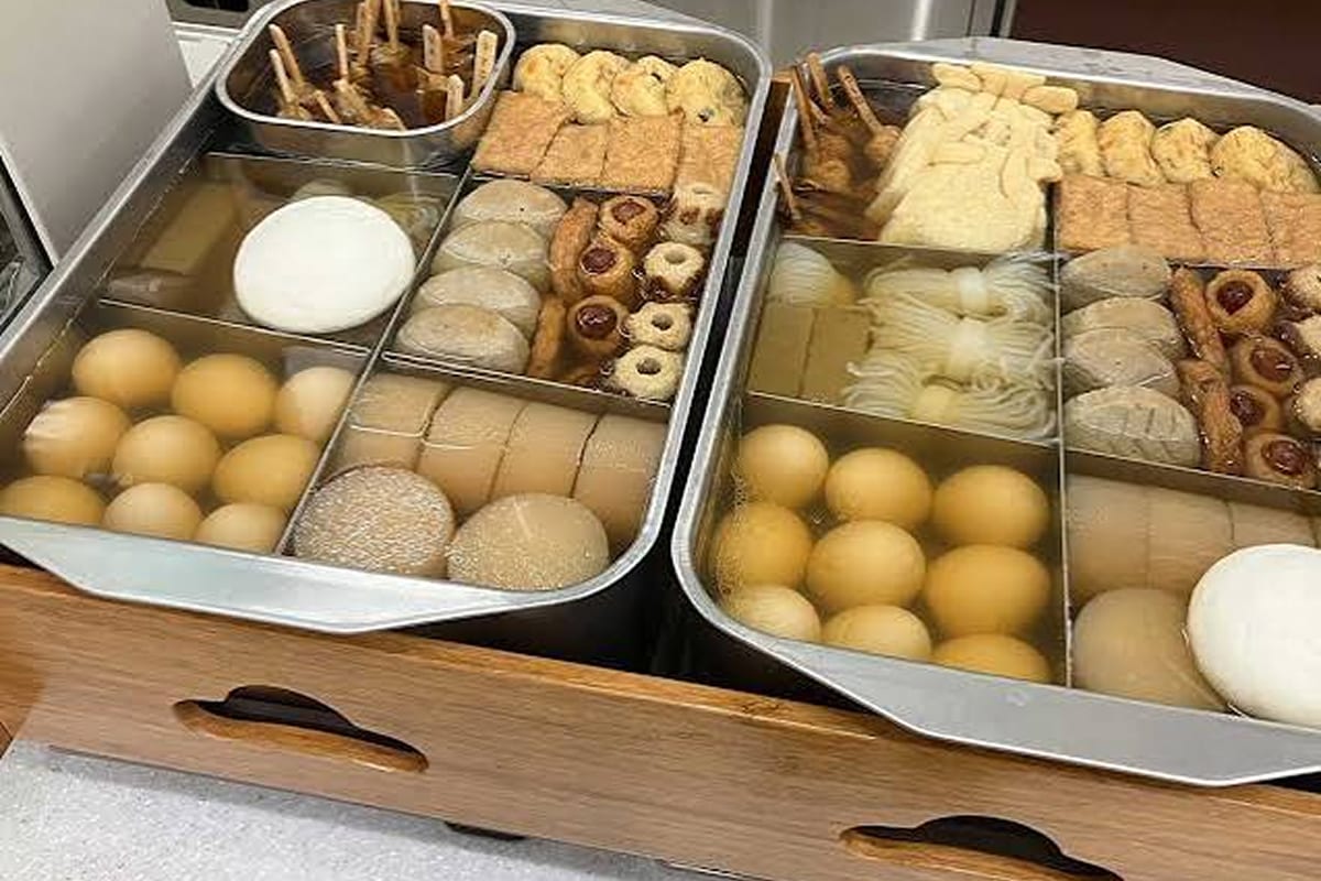 Oden ingredients displayed in a heated counter case at a Japanese 7-Eleven